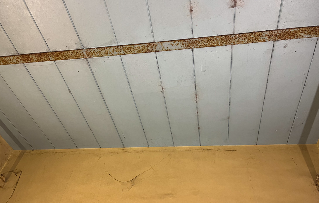 Painted RAAC roof panel soffit before strengthening